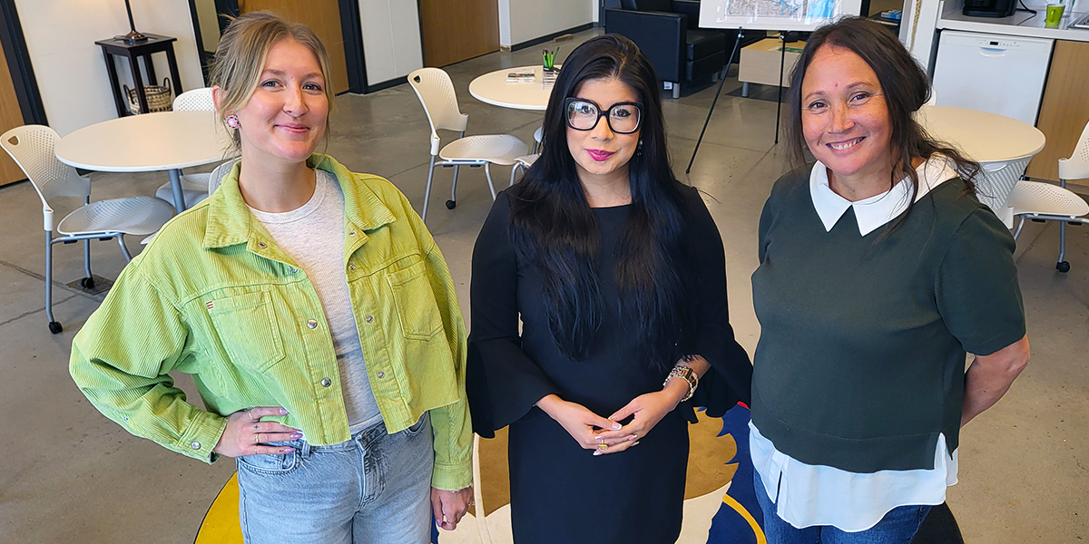 Kiana Cress, Dr. Kayla Murphy and Sherry Miller stand in the First Peoples Indigenous Centre.