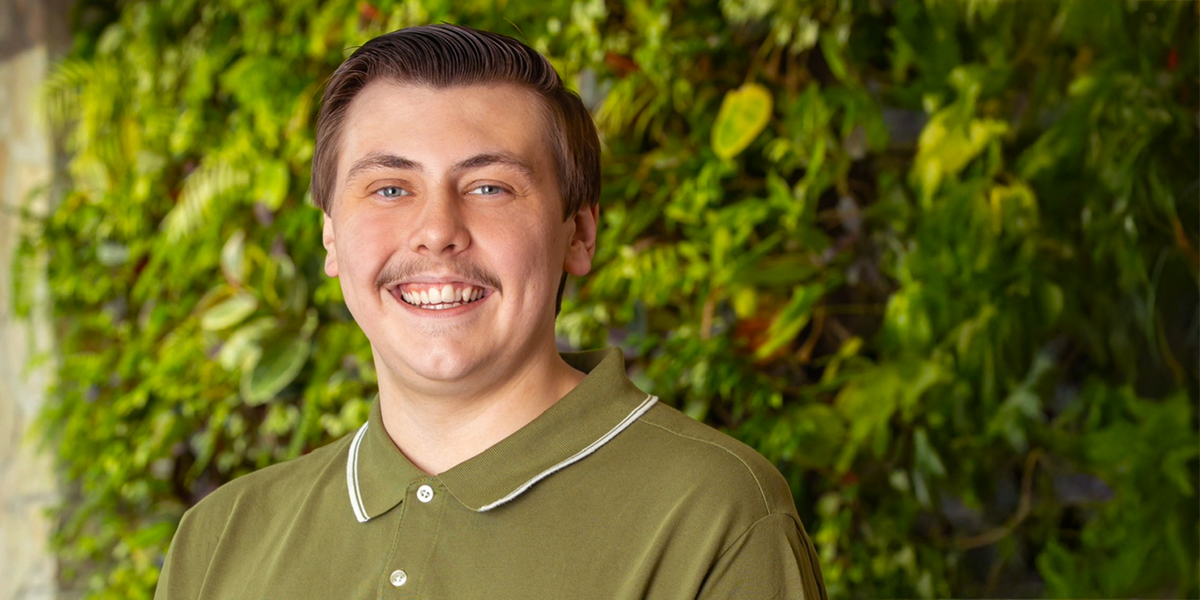 Max faces the camera and smiles.