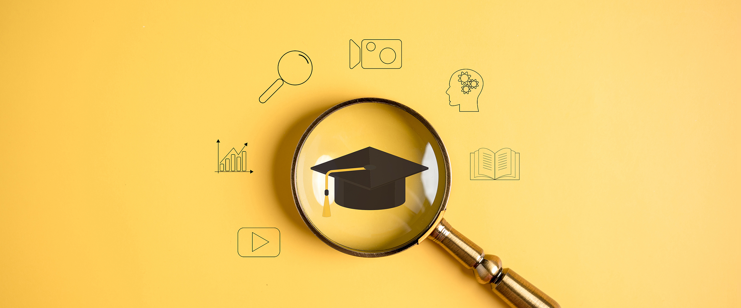 Series of tech icons and an icon of a graduation cap in the middle, magnified with a magnifying glass.
