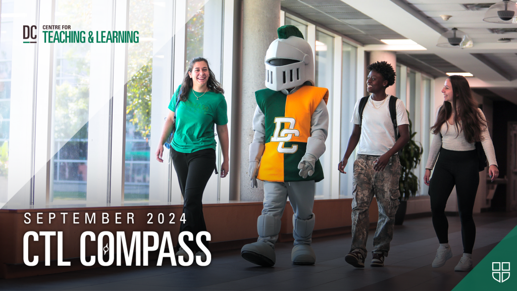 Students walking with Lord Louie in the halls of the Gordon Willey building, Oshawa campus.