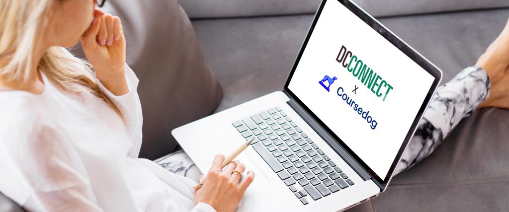 Student working on laptop while sitting on a couch.