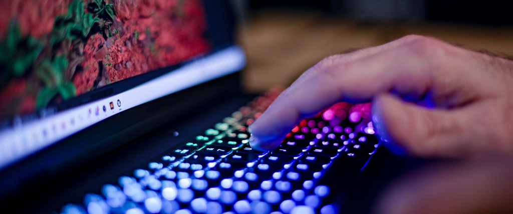 Student typing on a laptop.