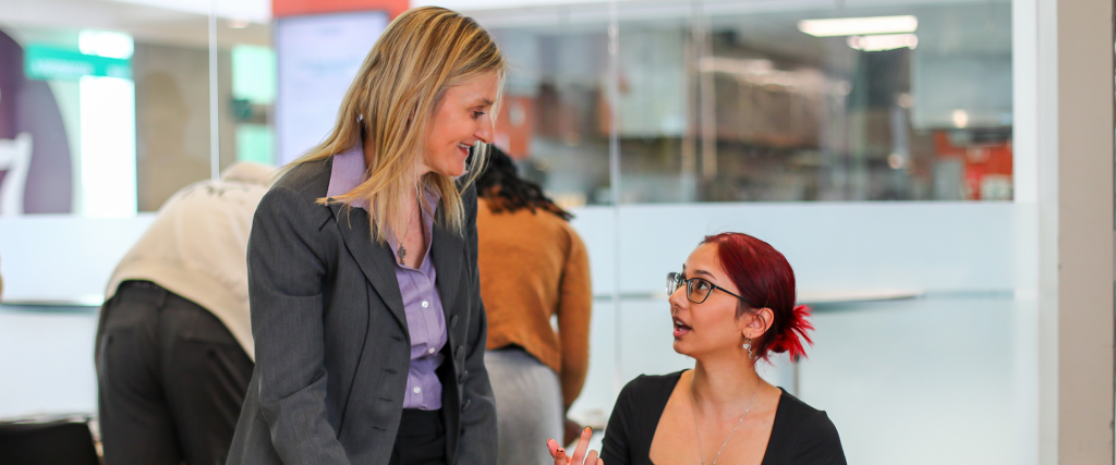 DC faculty member speaking to a student.
