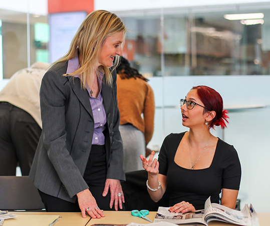 DC faculty member speaking to a student.