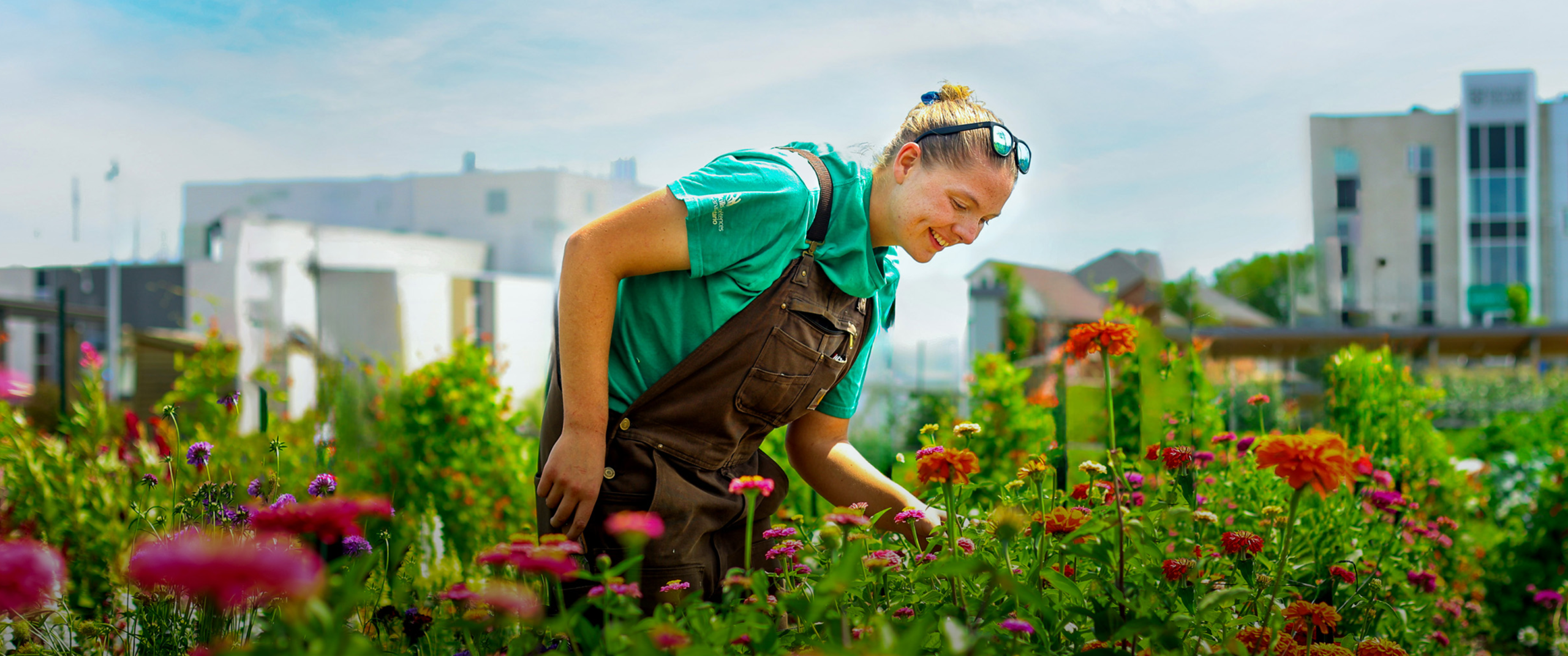 Student in the gardens at Whitby campus.