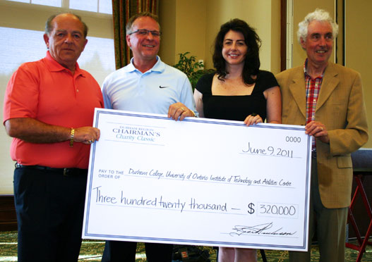 Chairman's Charity Classic participants holding cheque