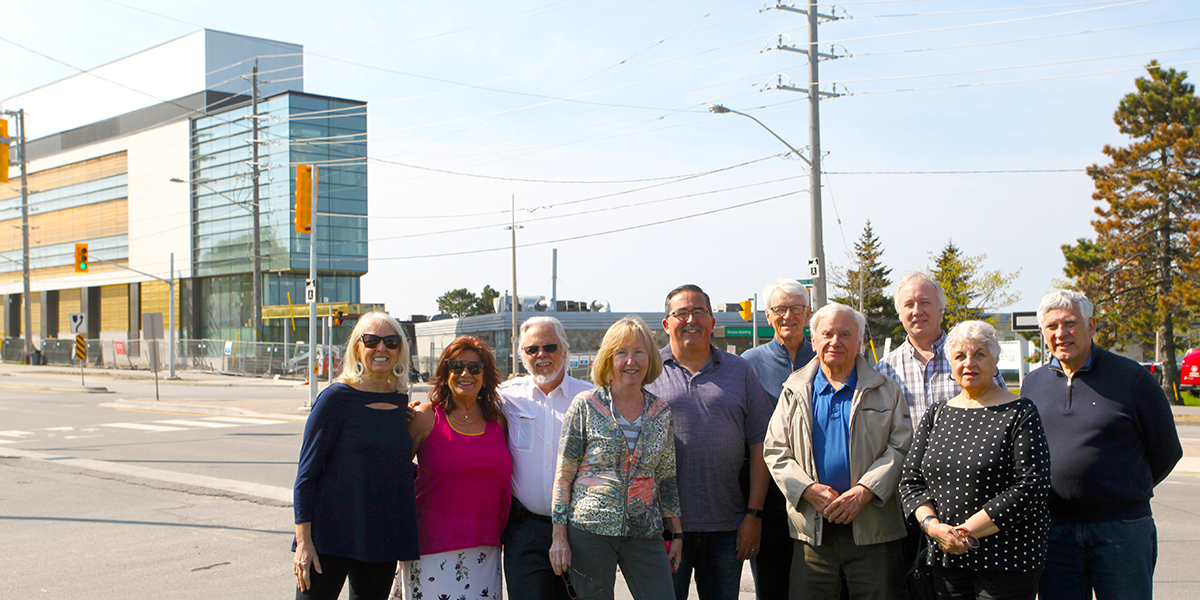 Durham College Retiree Association standing in front of CFCE building