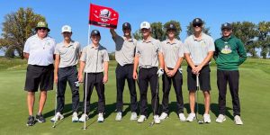 The DC Golf team smiles at the camera.