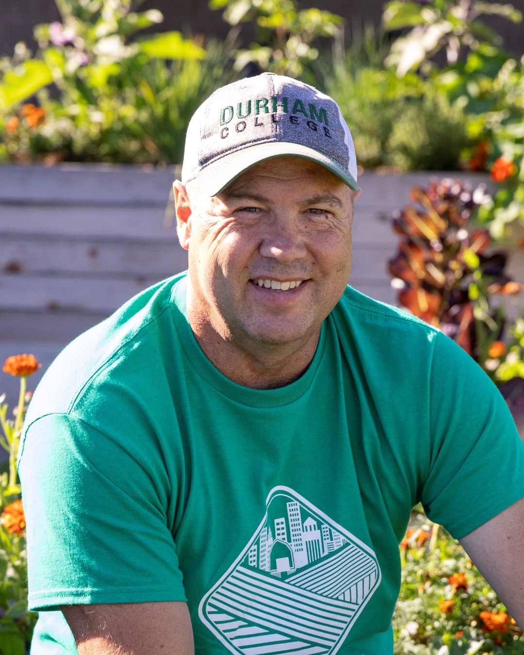 Paul Fritzsch sitting outside wearing a DC baseball hat.