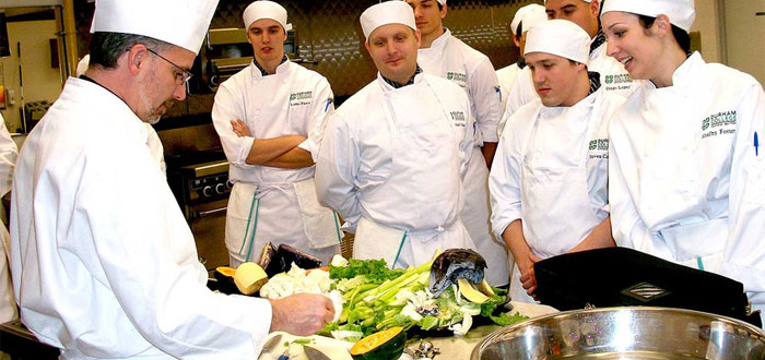 Culinary students prepare food to be served at Bistro Max.