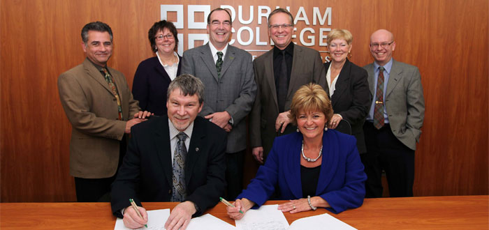 Durham College and Trent University sign an articulation agreement.