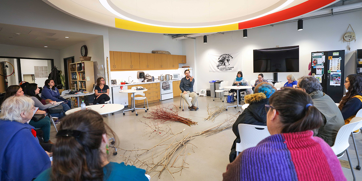 Members of the DC community sit in a circle in the First Peoples Indigenous Centre.