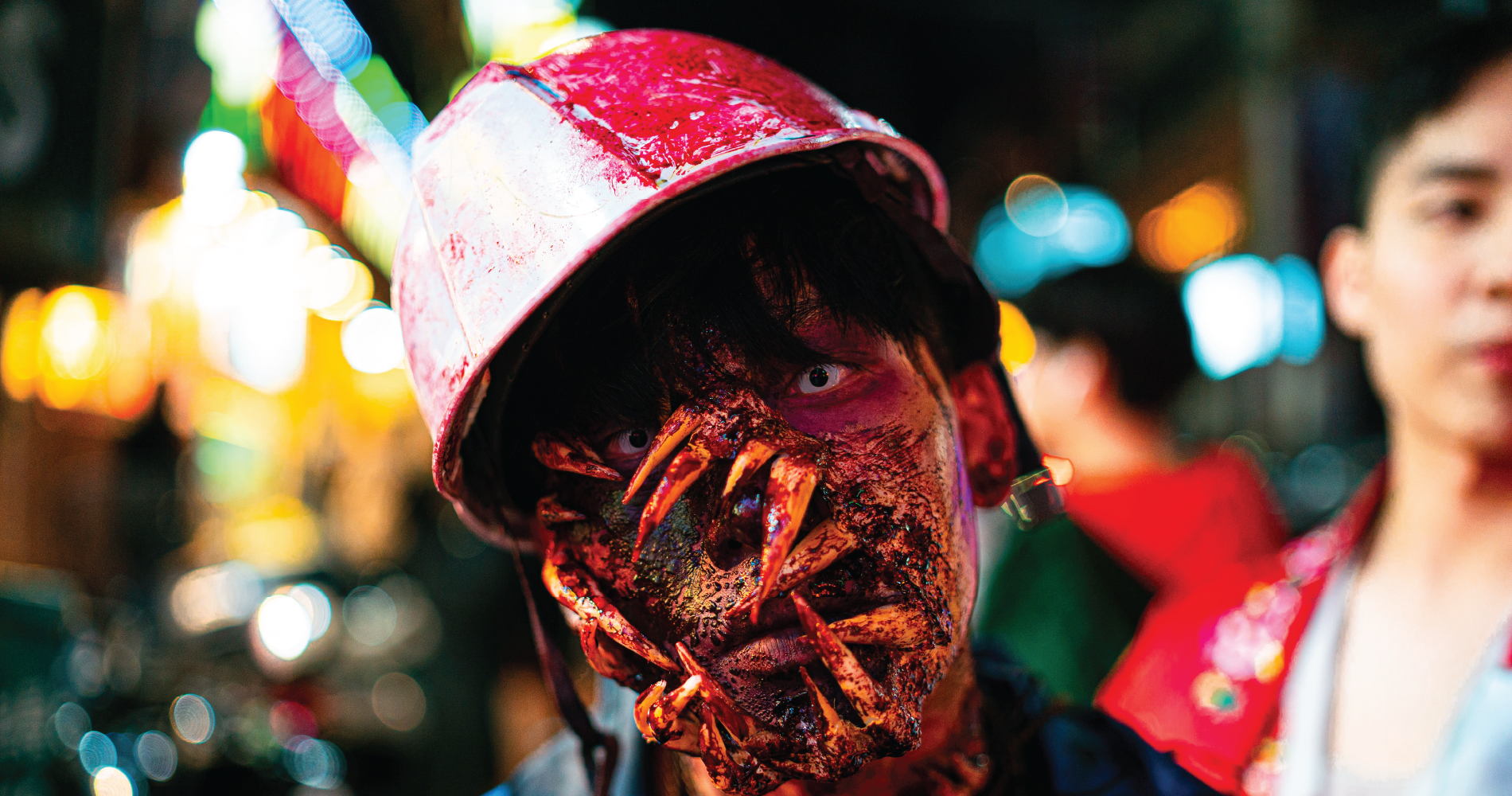 a person dressed as a zombie-Halloween Itaewon Street, Seoul, Korea