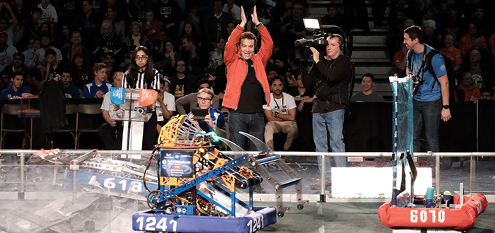 Rick Mercer cheering on students at the First Robotics Competition