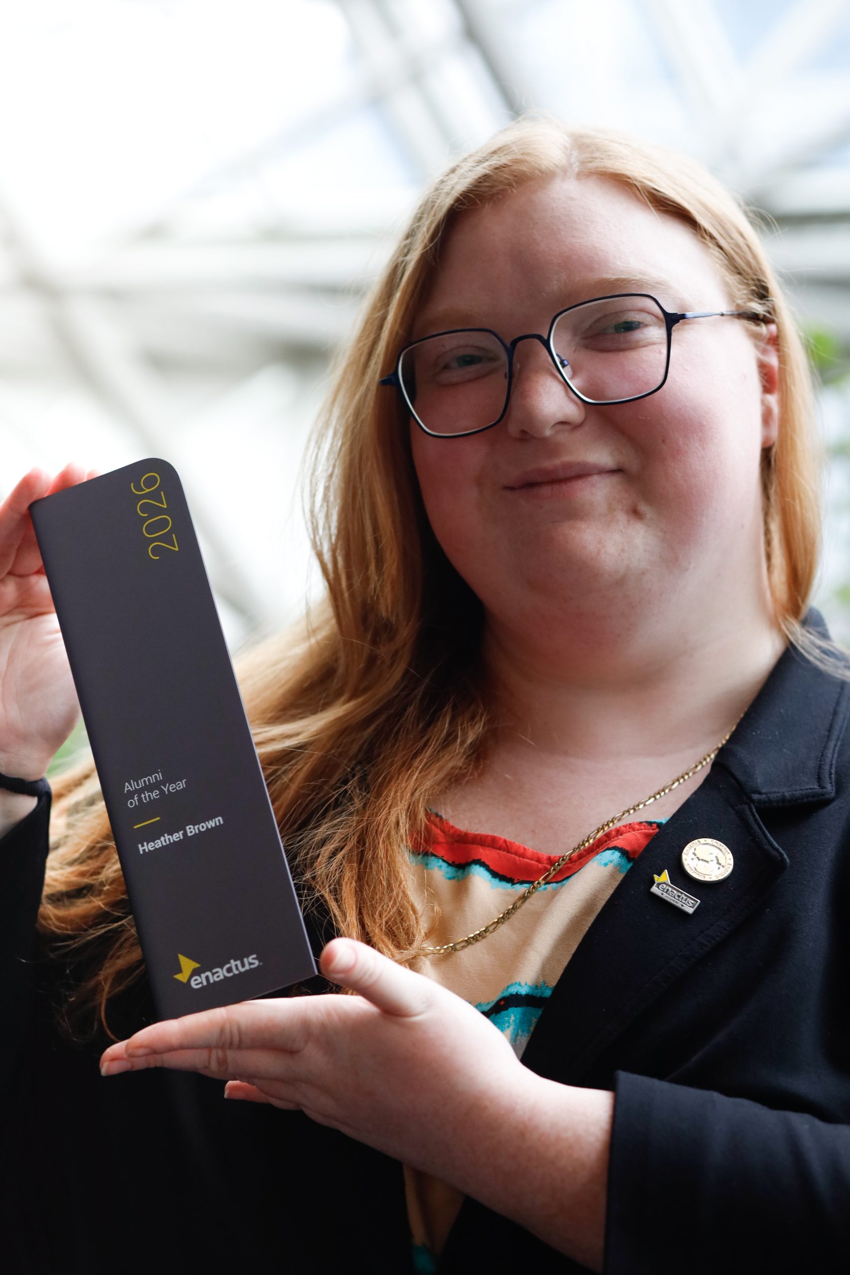 Heather Brown holding award