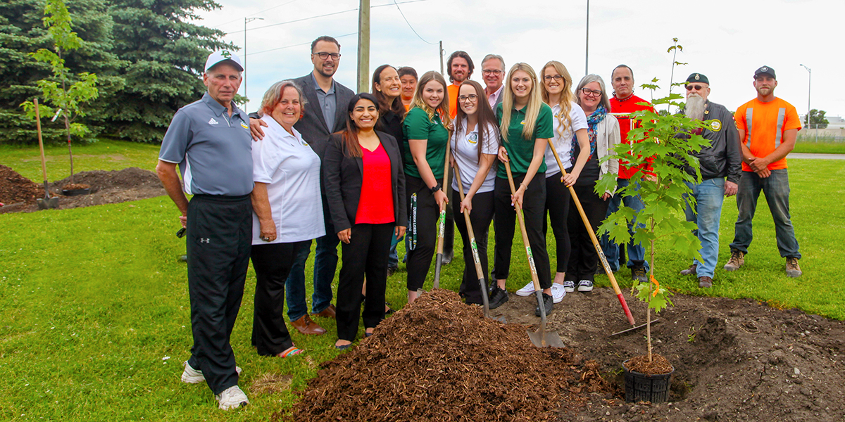 DC employees and students participate in the Highway of Heroes Tree Campaign planting ceremony