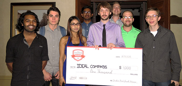 Group of students holding a giant cheque