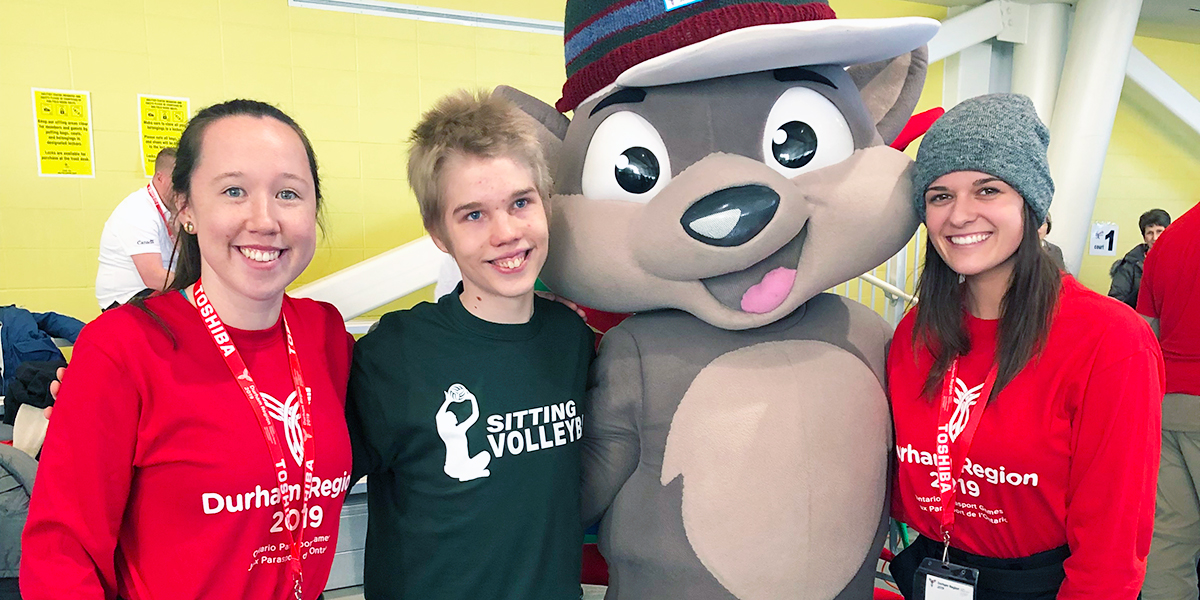 Parasport Games mascot taking picture with participants