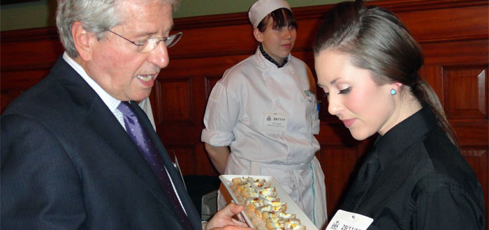 DC students serve food to MPPs at Queen's Park