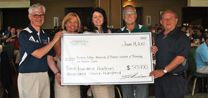 Cheque presentation at Chairman's Charity Classic golf tournament