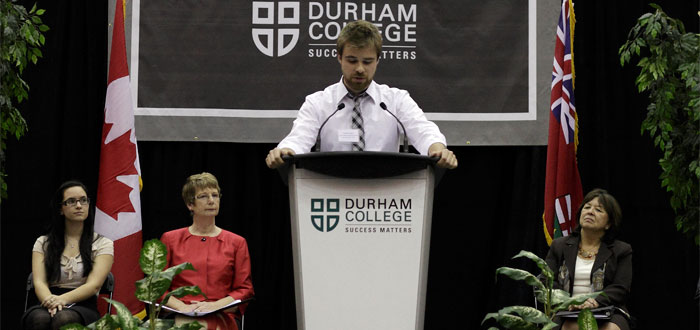 Speaker on podium during annual scholarship ceremony