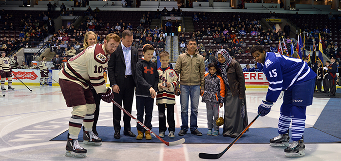 Syrian refugees drop the puck at hockey game