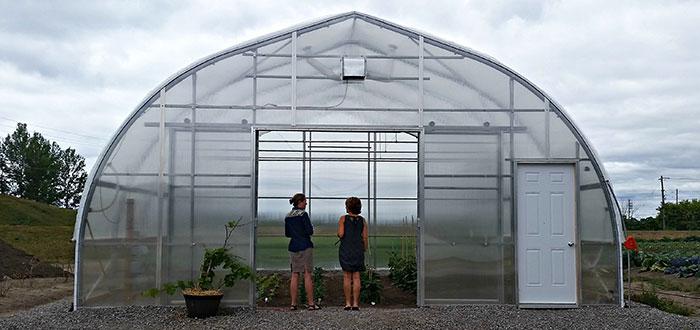 Master gardeners tour hoop house at Centre For Food.
