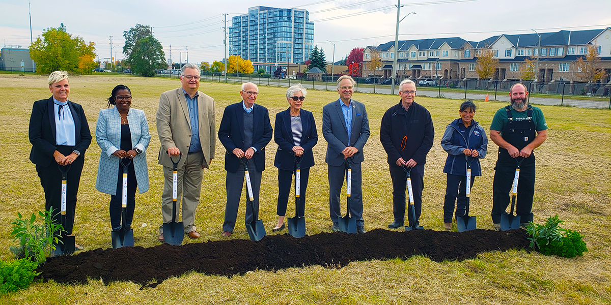 Stakeholders from , Durham College (DC), the Barrett Family Foundation, Invest Durham with shovels in the ground in front of new land plot