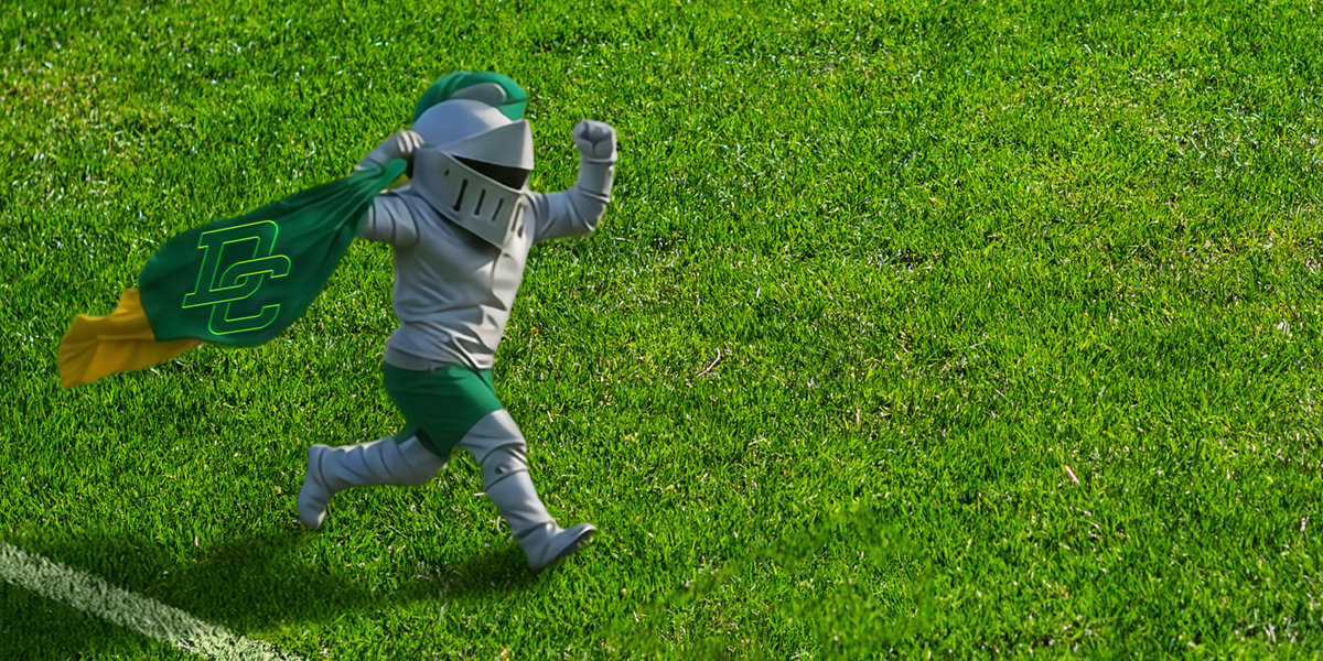 DC Mascot Louie The Lord waving DC Flag across Vaso's field