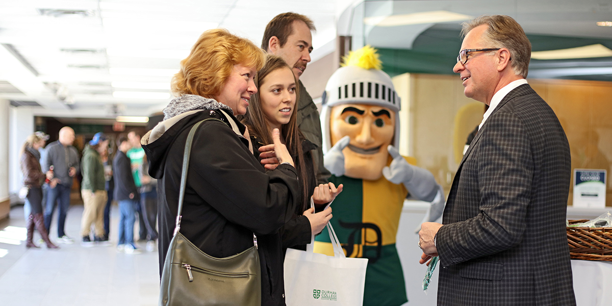 President Don Lovisa greets guests at Durham College's Open House event.