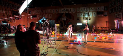 cast and crew of Tyler Medeiros’ new music video set up a take inside the gym at Durham College