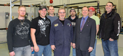 Durham College Professor Tom Marley and a group of Level 1 Industrial Mechanic Millwright apprenticeship students