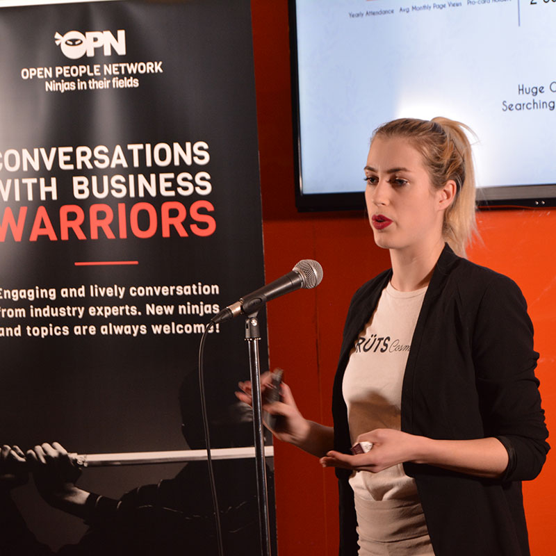 Pretty female speaker during a Fast Start event