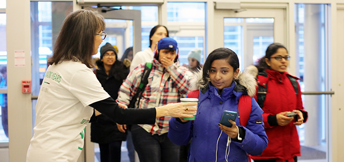 DC students arrive to campus and receive a welcome back hot chocolate from staff.