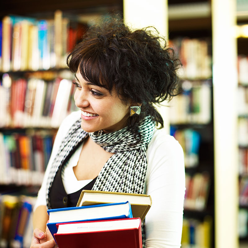 DC Students checking out books at the Library.