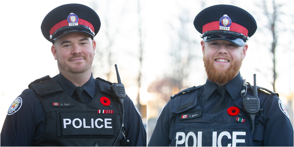 Aaron Dale and Jeremy Burns in their Toronto Police uniforms wearing poppies for Remembrance Day.