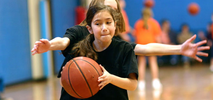 Children playing basketball at the Durham College Campus Recreation and Wellness Centre